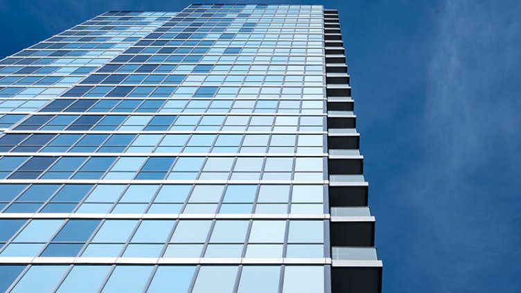 High rise building with blue mirrors