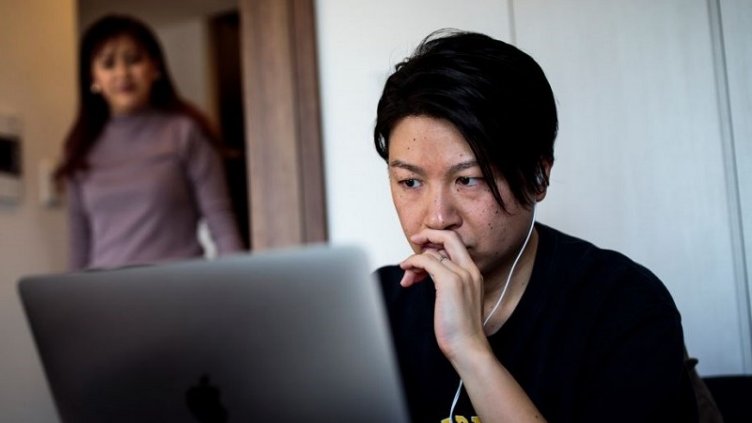 Tech-savvy employee working in his home