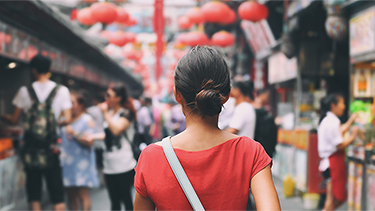 Tourist walking in city streets on Asia vacation tourism