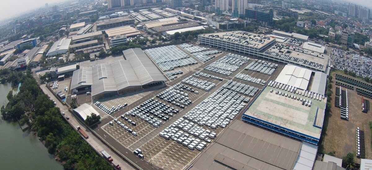 Beautiful aerial view of automobile manufacturing warehouses with parking