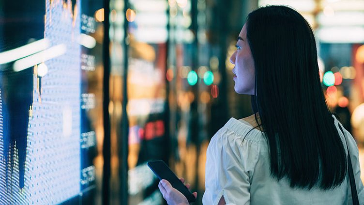 A female looking into reits breaking stock list