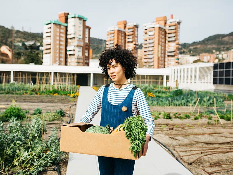 A woman holding a vegetable basket